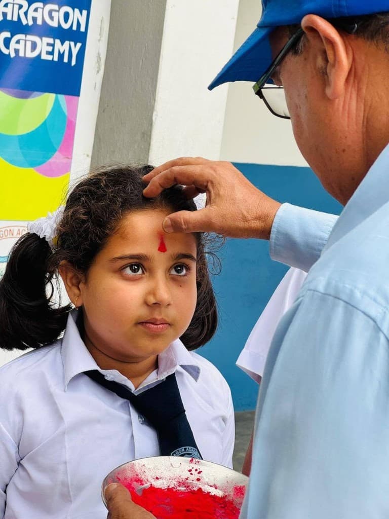 Student receiving tika at Paragon Academy