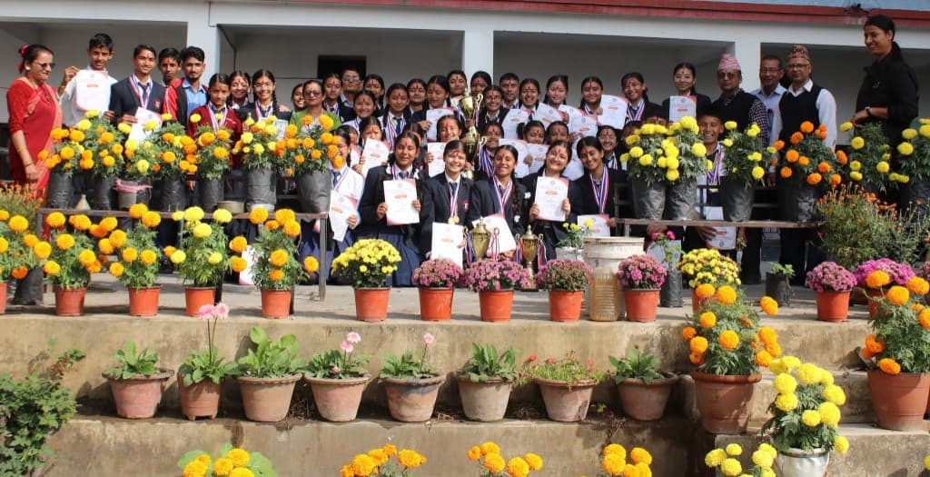 Students with trophies and certificates at Paragon Academy